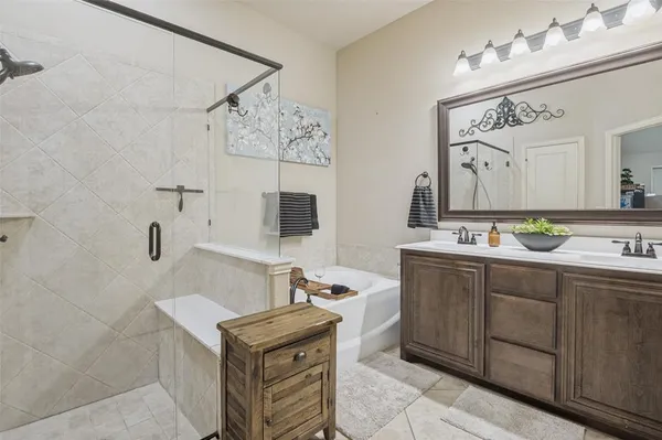 a bathroom with a sink double vanity and a mirror