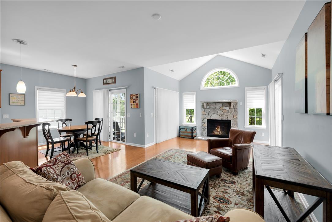 1011 Resolution Drive Bethlehem, PA 18017 - Photo 10 of 49 a living room with furniture a fireplace and a large window