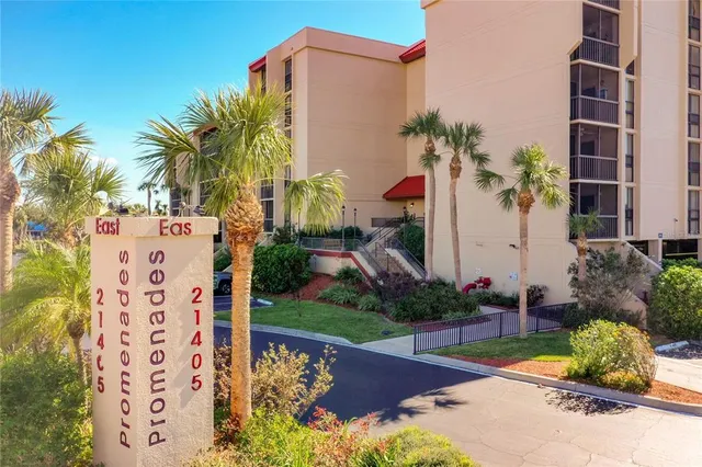 front view of a building with potted plants