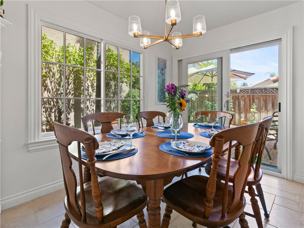24822 Cutter Laguna Niguel, CA 92677 - Photo 13 of 49 a dining room with furniture a large window and a chandelier