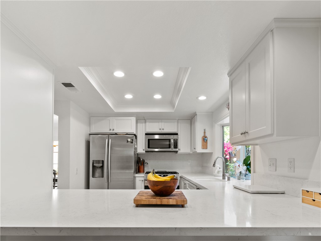 24822 Cutter Laguna Niguel, CA 92677 - Photo 18 of 49 a kitchen with stainless steel appliances granite countertop a refrigerator sink and stove