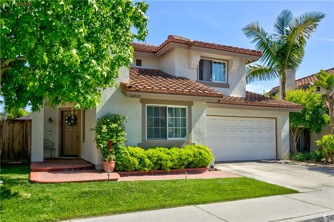 24822 Cutter Laguna Niguel, CA 92677 - Photo 2 of 49 a front view of a house with a garden and plants