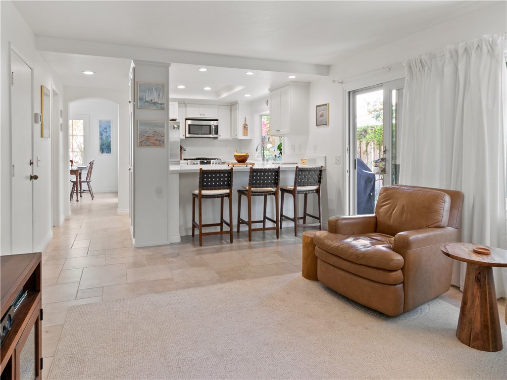 24822 Cutter Laguna Niguel, CA 92677 - Photo 21 of 49 a living room with furniture and a dining table with kitchen view