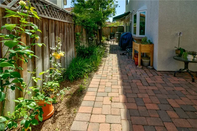 a bunch of flowers in front of house