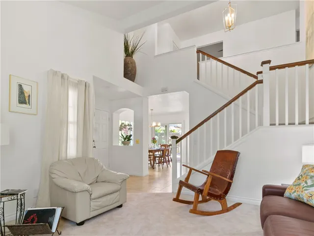 a living room with furniture and a chair