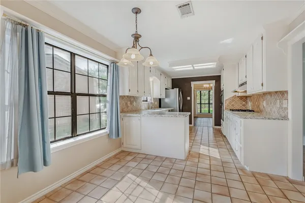 a view of a kitchen with windows