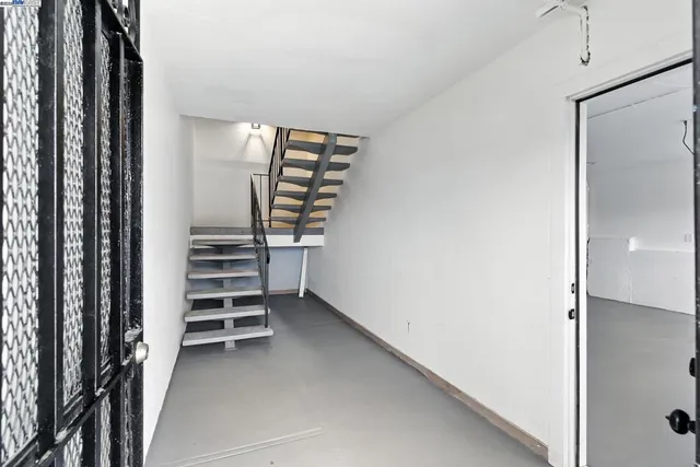 a view of room with stairs and a window