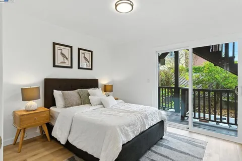 a bedroom with a large bed and a large window