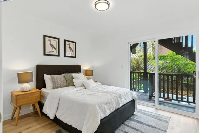 a bedroom with a large bed and a large window
