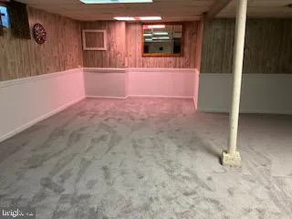 a bathroom with a toilet a sink and a mirror