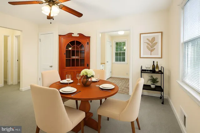 a view of a dining room with furniture and window