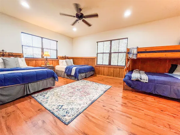 a bedroom with two beds and a couch