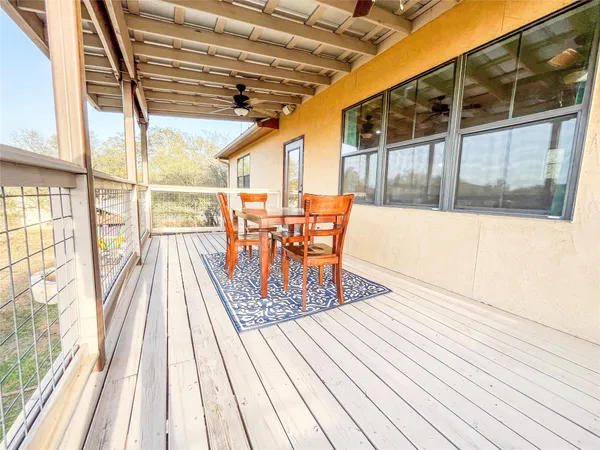 a balcony with wooden floor
