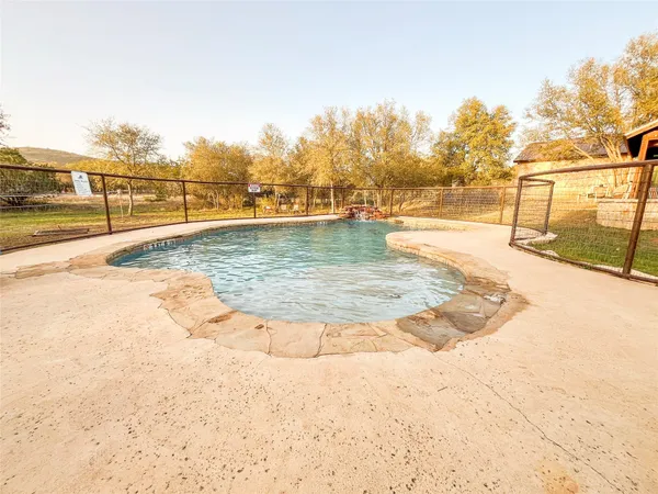 a view of a swimming pool with an outdoor space