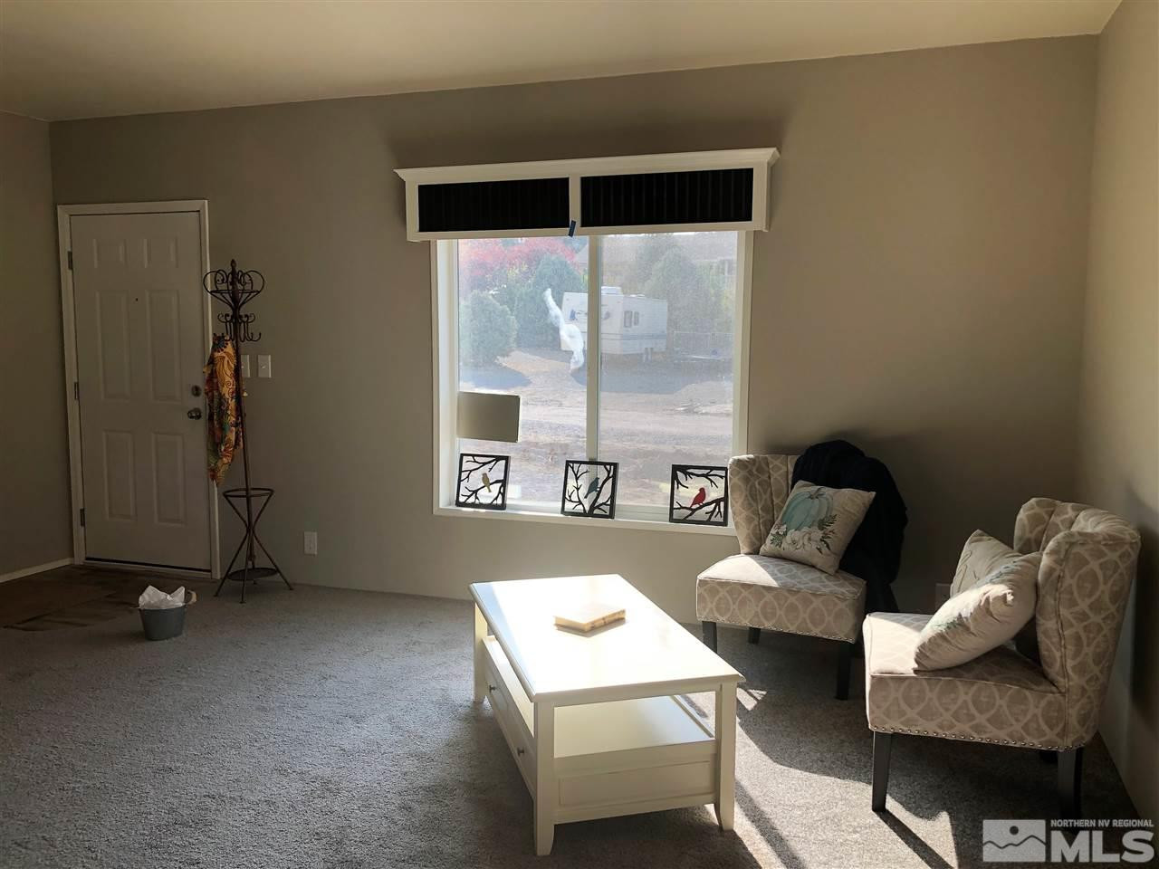 15380 Tuxon Way Reno, NV 89521 - Photo 11 of 25 a living room with furniture and a window