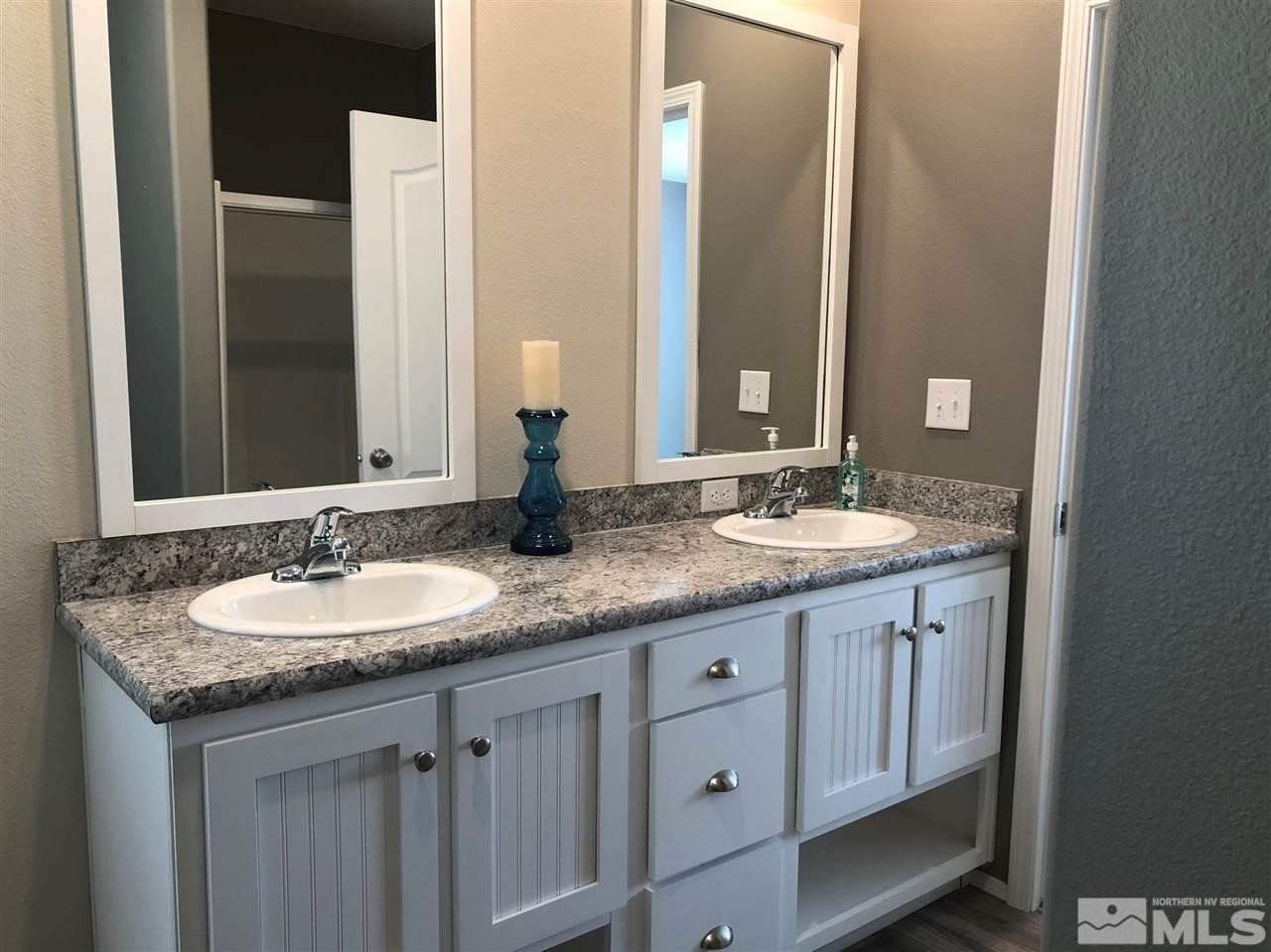 15380 Tuxon Way Reno, NV 89521 - Photo 16 of 25 a bathroom with a granite countertop double sink and a mirror