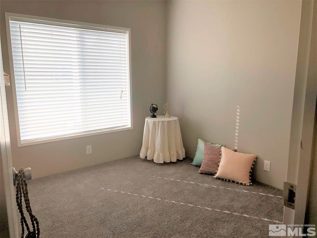 15380 Tuxon Way Reno, NV 89521 - Photo 19 of 25 a room with a bed and a window