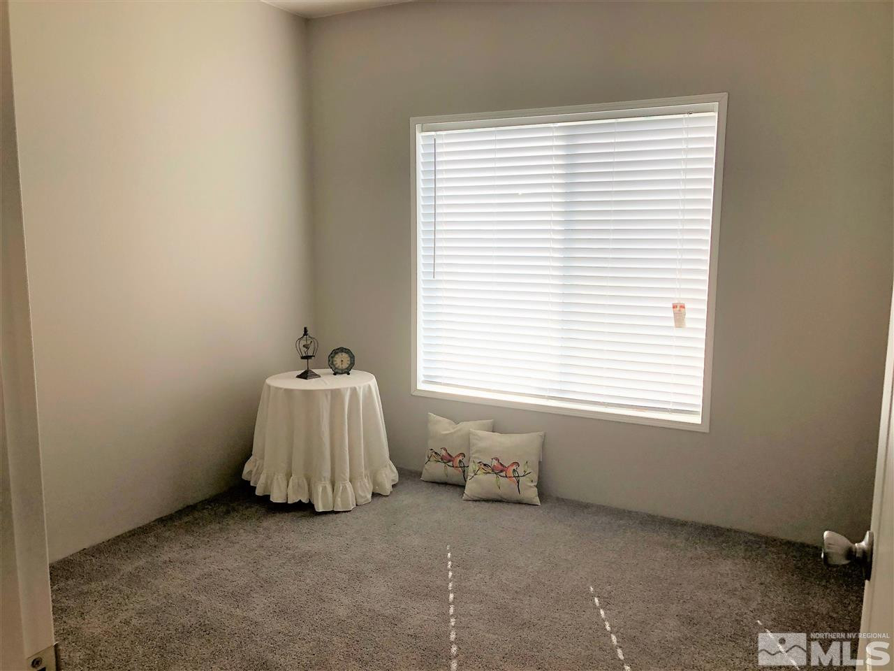15380 Tuxon Way Reno, NV 89521 - Photo 20 of 25 a room with a bed and a window