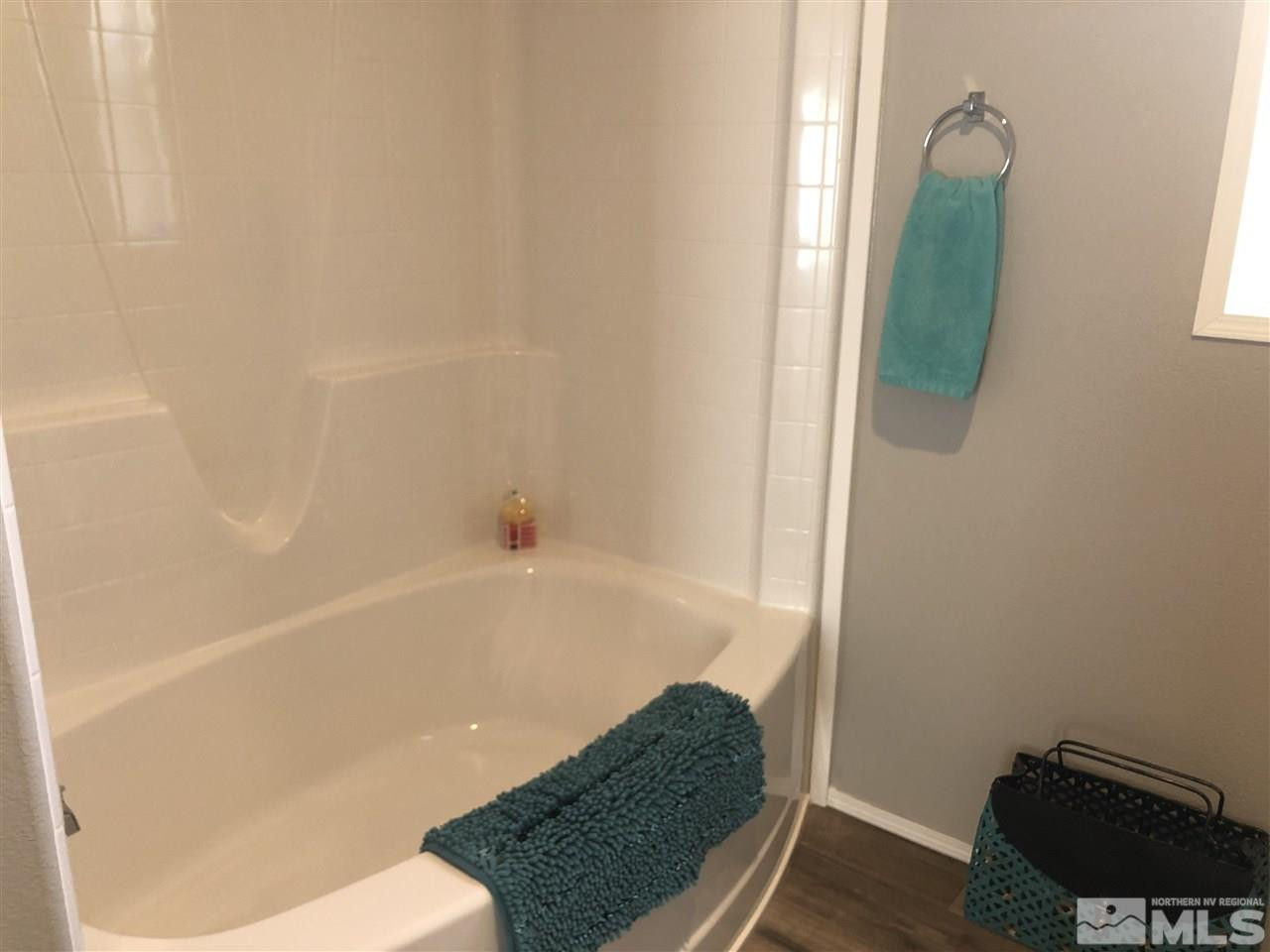 15380 Tuxon Way Reno, NV 89521 - Photo 22 of 25 a bathroom with a bathtub and a shower
