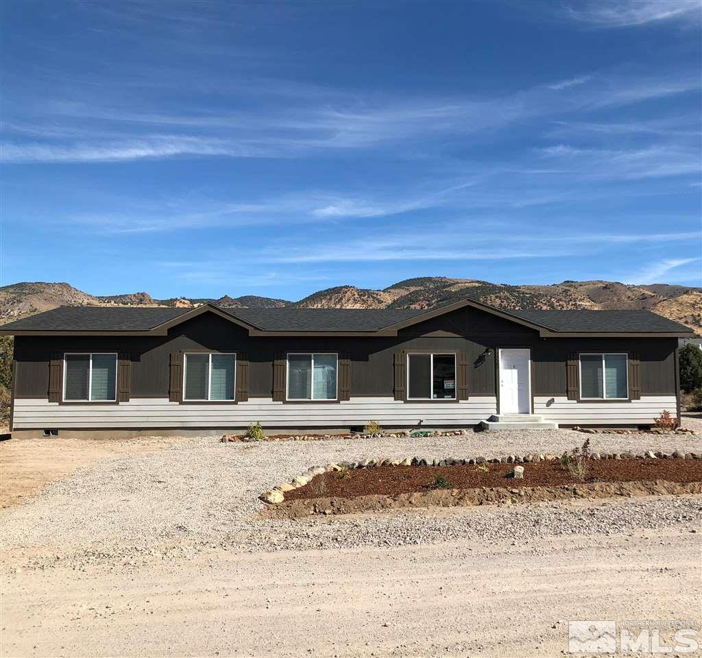 15380 Tuxon Way Reno, NV 89521 - Photo 7 of 25 a front view of a house with a yard