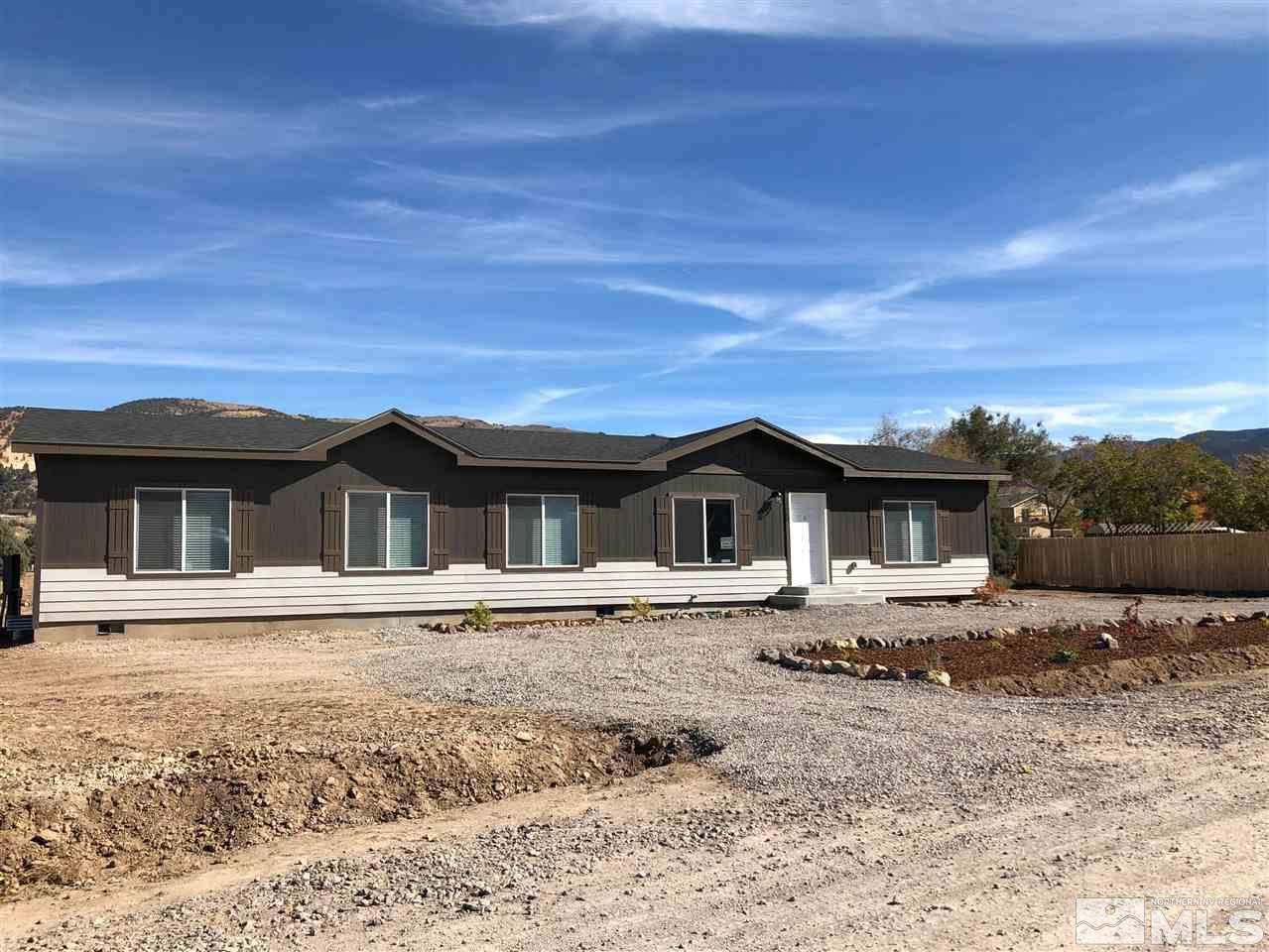 15380 Tuxon Way Reno, NV 89521 - Photo 8 of 25 a front view of a house with a yard