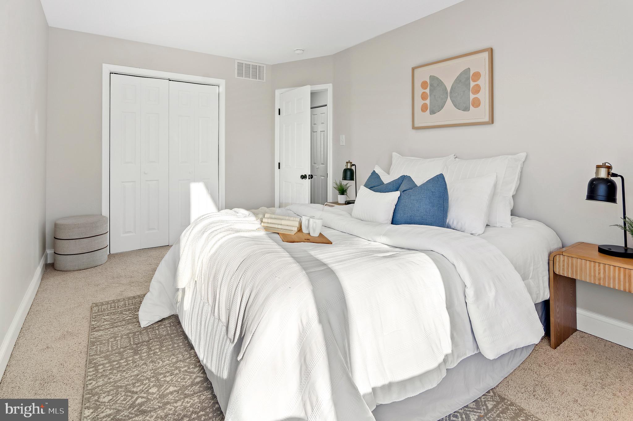 1237 Willow Road Dundalk, MD 21222 - Photo 23 of 29 a bedroom with a white bed and a couch