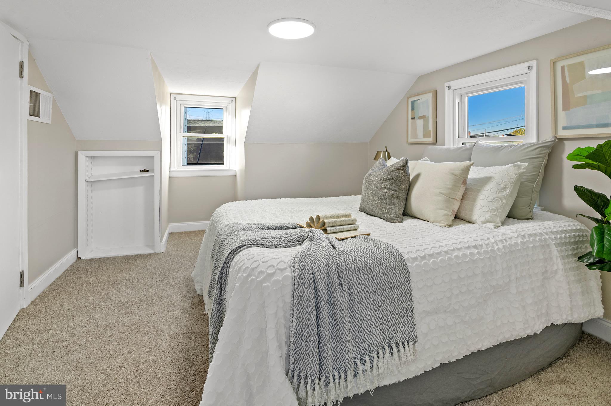 1237 Willow Road Dundalk, MD 21222 - Photo 24 of 29 a bedroom with a bed and painting on the wall