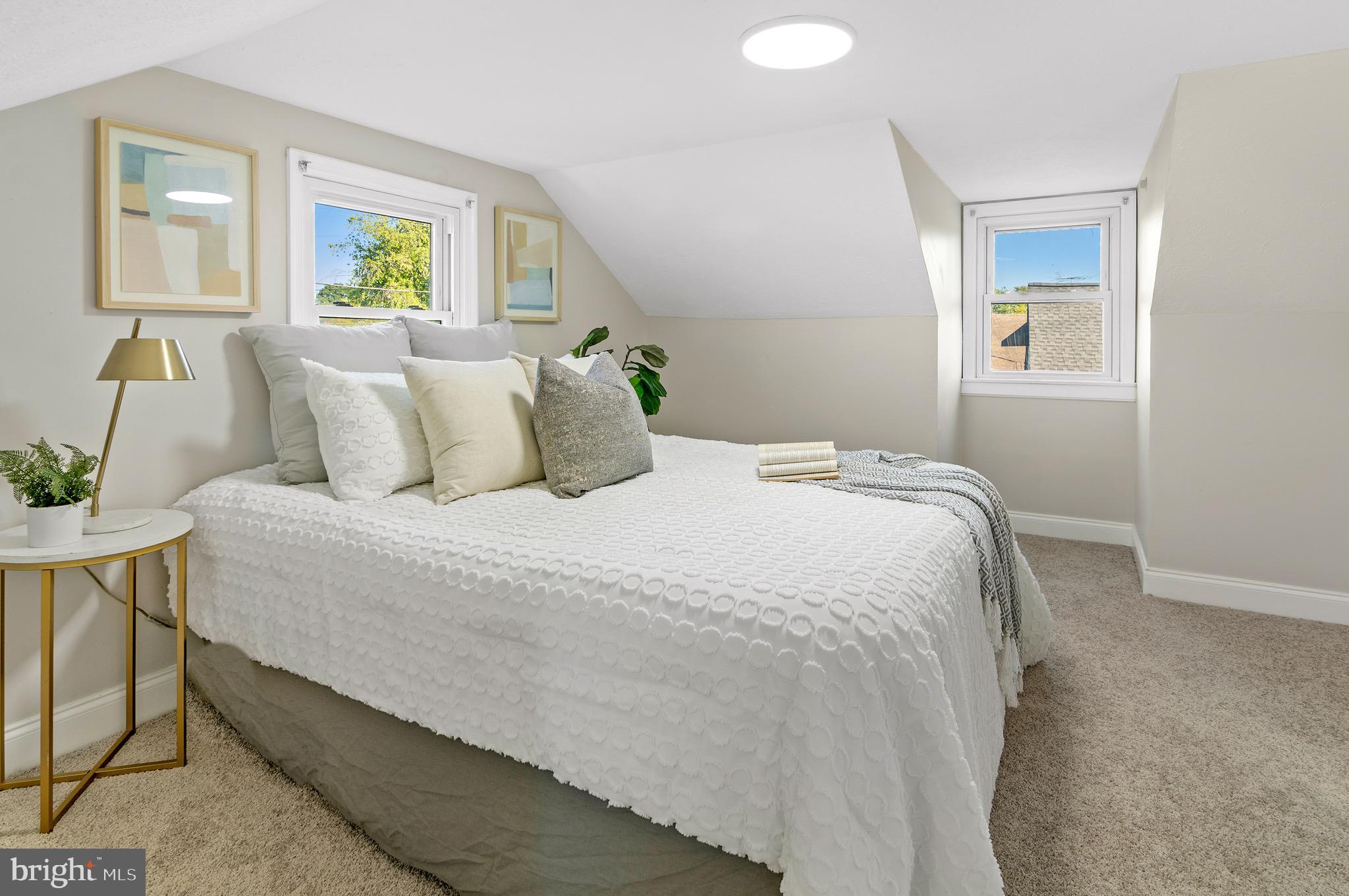 1237 Willow Road Dundalk, MD 21222 - Photo 25 of 29 a bedroom with a bed and painting on the wall