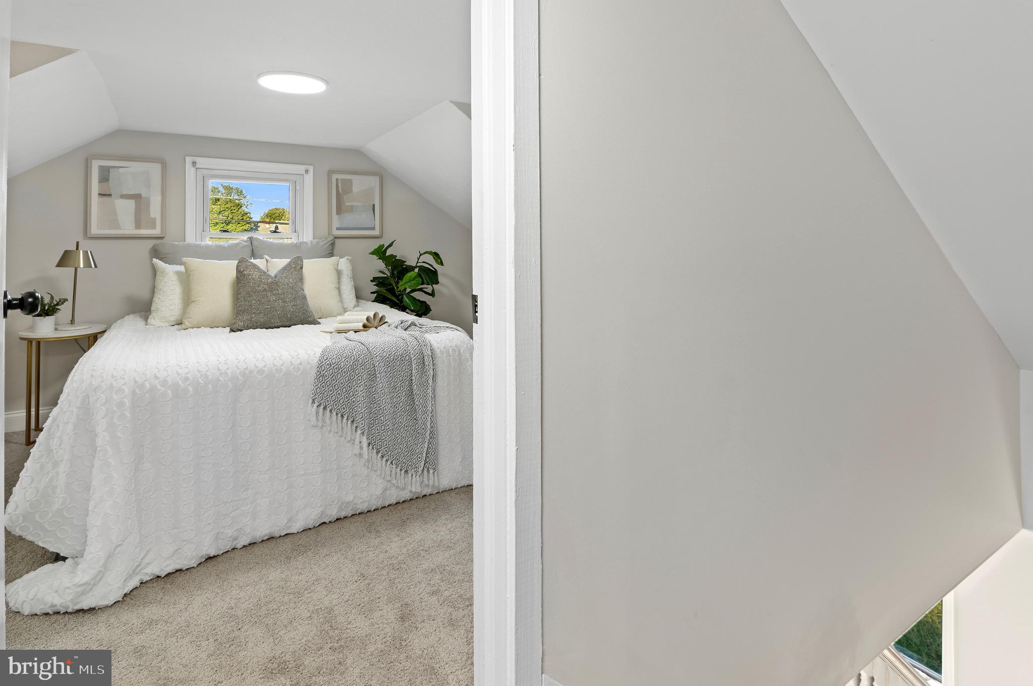 1237 Willow Road Dundalk, MD 21222 - Photo 26 of 29 a bedroom with a bed and window