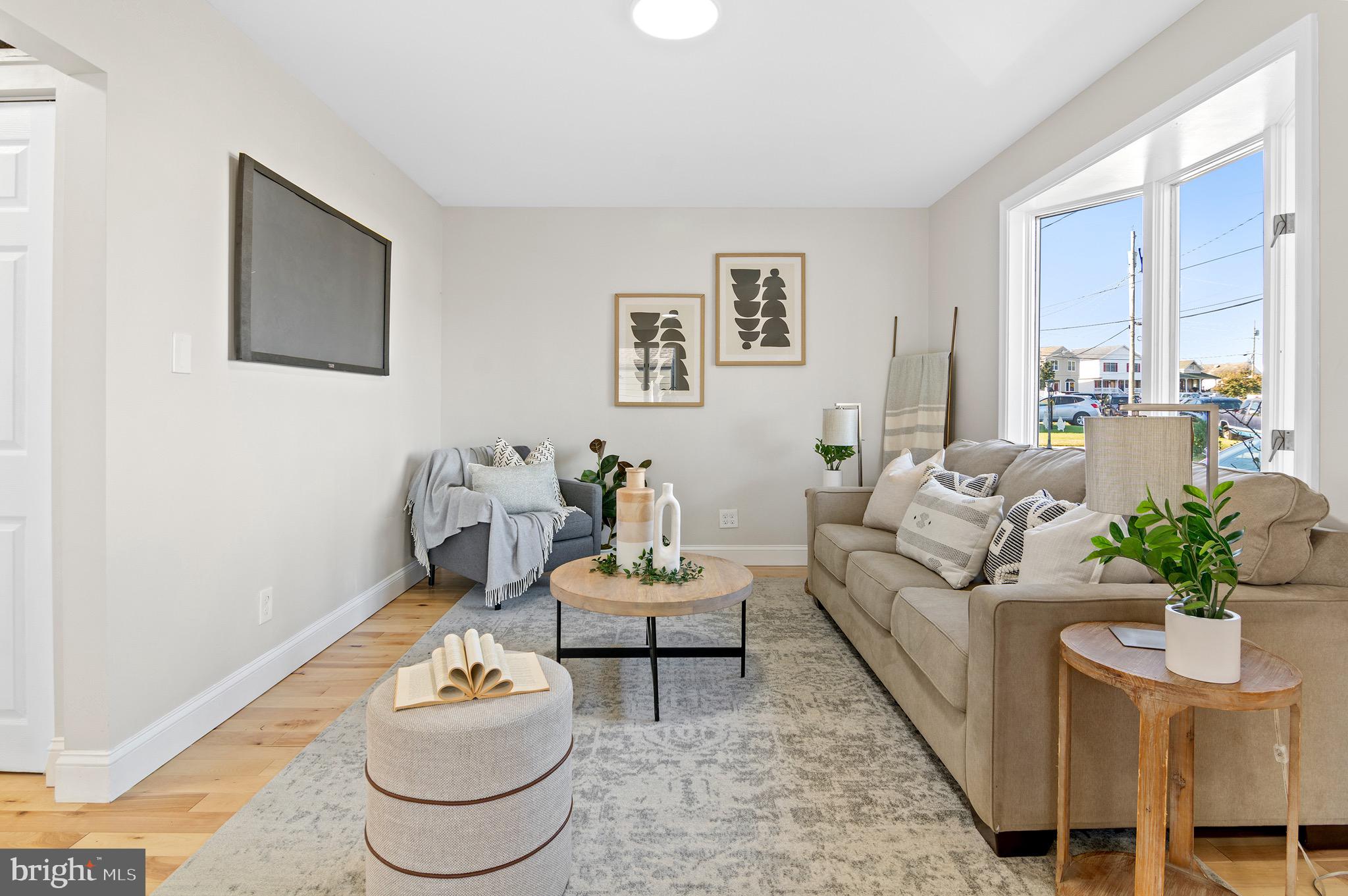 1237 Willow Road Dundalk, MD 21222 - Photo 3 of 29 a living room with furniture a rug and a table