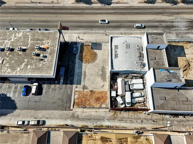 an aerial view of multi story residential apartment building with yard