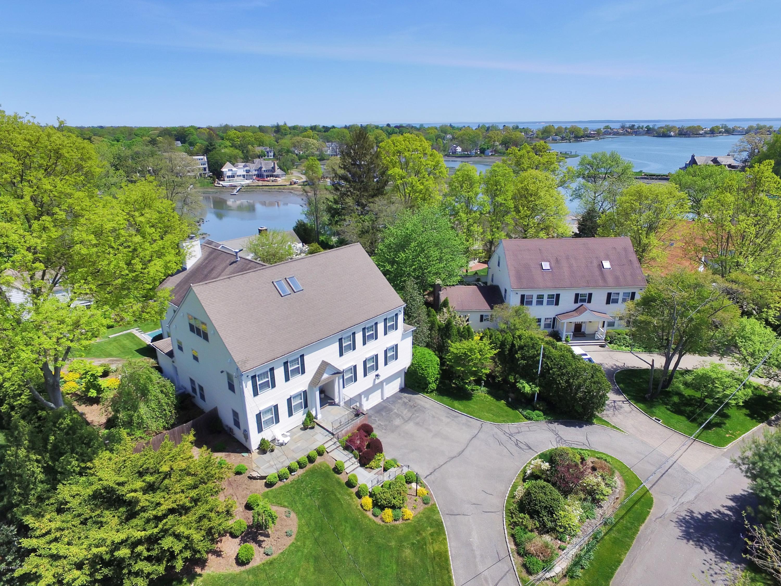 9 Palmer Lane Riverside, CT 06878 - Photo 1 of 29 an aerial view of a house with garden space and outdoor seating
