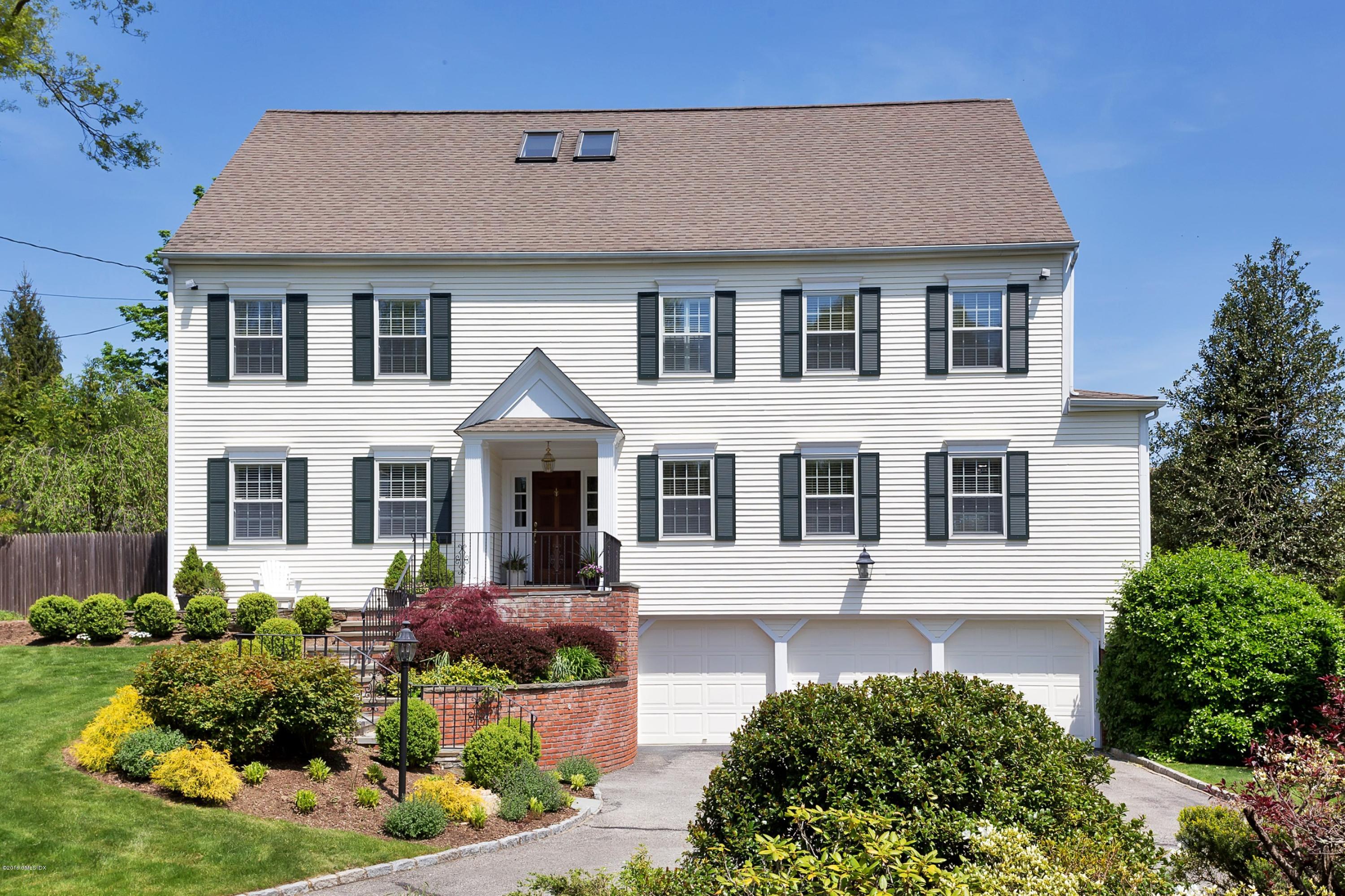 9 Palmer Lane Riverside, CT 06878 - Photo 2 of 29 a front view of a house with a yard