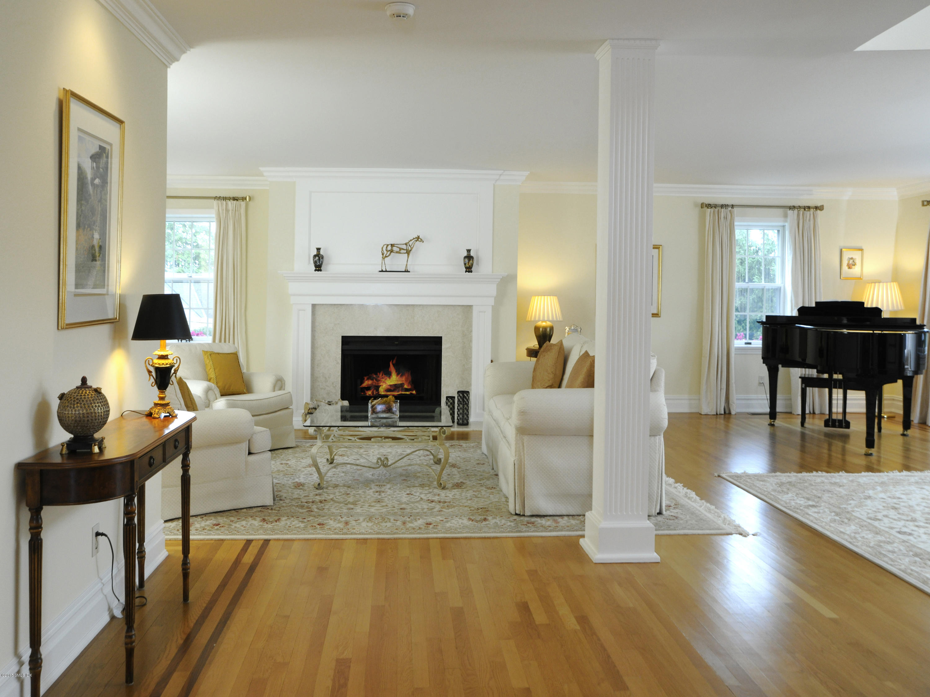 9 Palmer Lane Riverside, CT 06878 - Photo 6 of 29 a living room with furniture and a fireplace