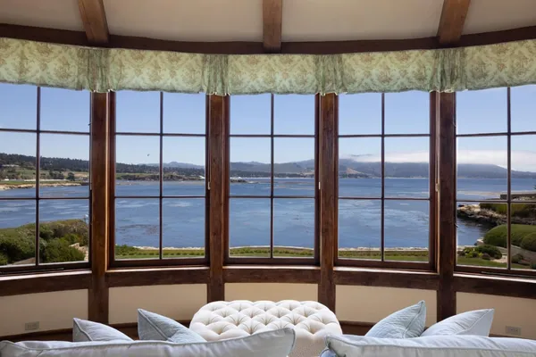 a view of a living room and a balcony