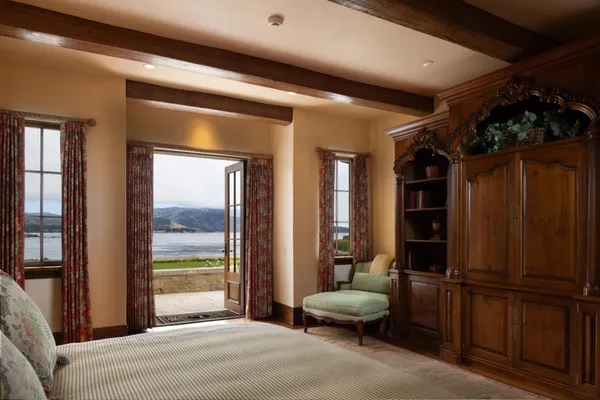 a bedroom with furniture and a window
