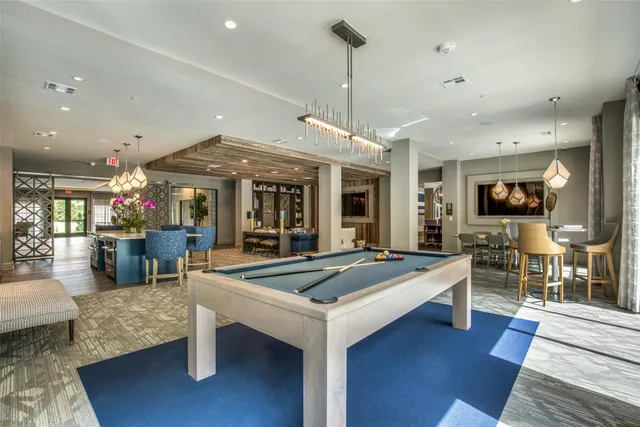 a view of a dining room with furniture wooden floor and chandelier