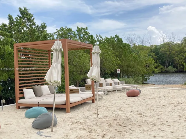 swimming pool view with a seating space