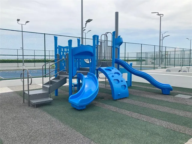 a front view of a building with a yard