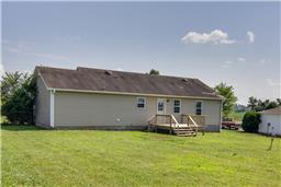 376 Howell Hill Road Kelso, TN 37348 - Photo 11 of 13 a front view of a house with garden