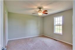 376 Howell Hill Road Kelso, TN 37348 - Photo 7 of 13 an empty room with windows and fan