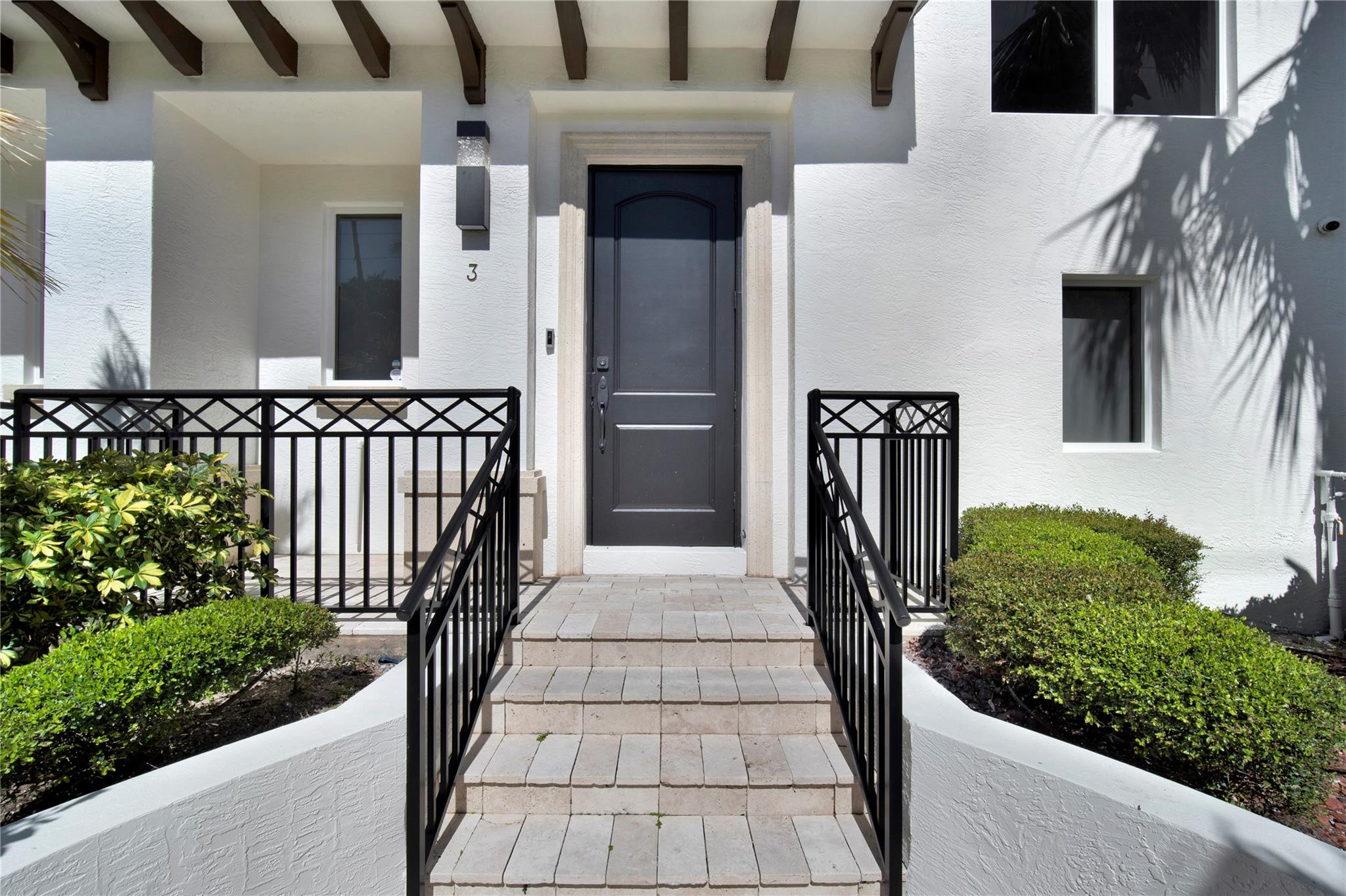 425 North Ocean Boulevard, Unit 3 Boca Raton, FL 33432 - Photo 3 of 69 a front view of a house with a porch