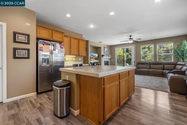 a kitchen with a sink window and cabinets