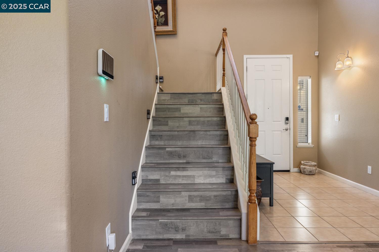 1117 Van Gogh Lane Patterson, CA 95363 - Photo 22 of 55 a view of entryway and hall with wooden floor