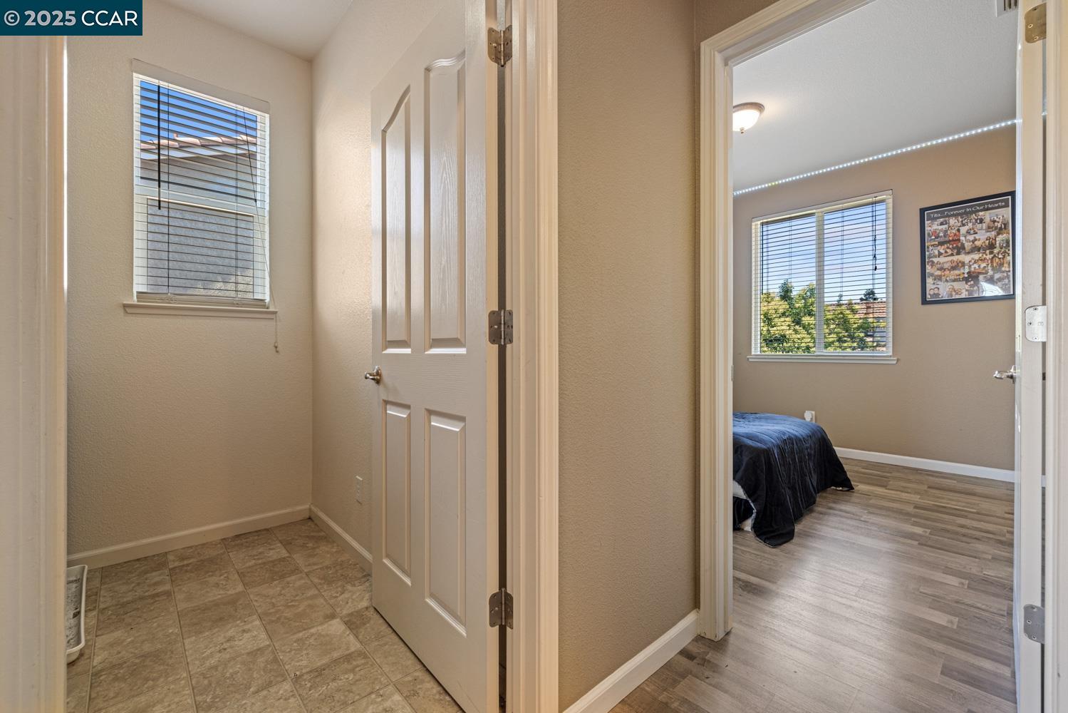 1117 Van Gogh Lane Patterson, CA 95363 - Photo 27 of 55 a view of a hallway and closet with wooden floor