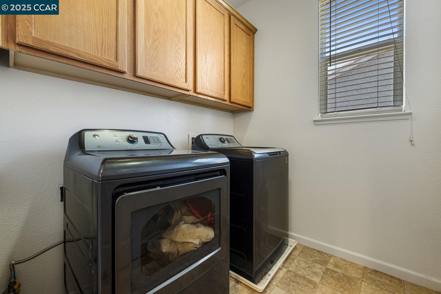 1117 Van Gogh Lane Patterson, CA 95363 - Photo 28 of 55 a close up view of washer and dryer