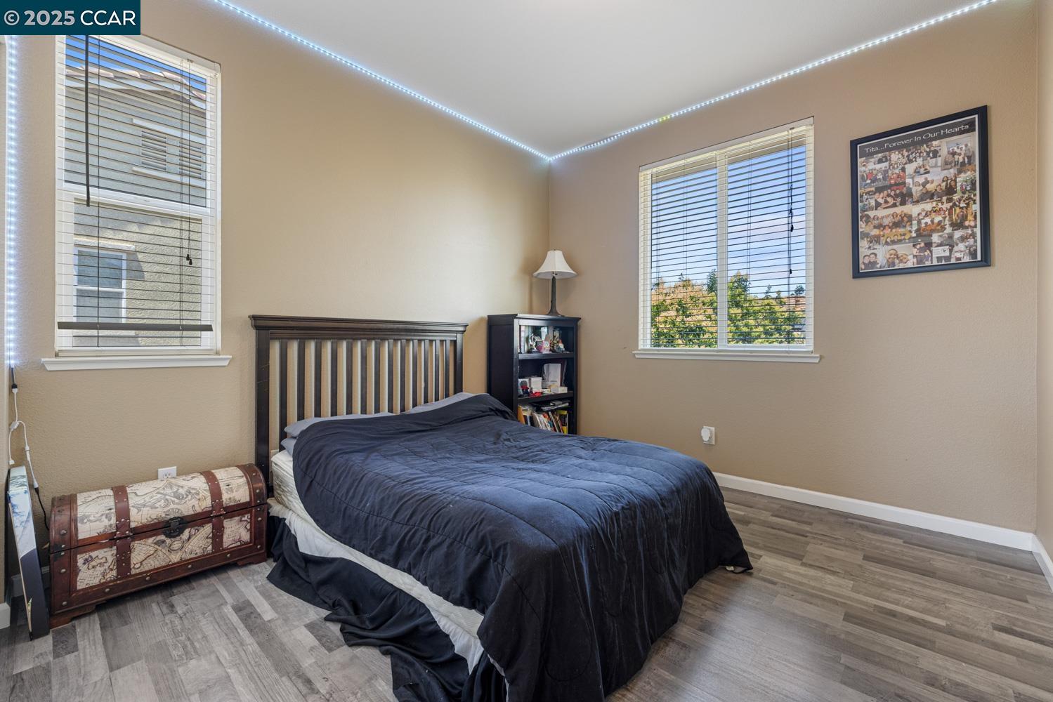 1117 Van Gogh Lane Patterson, CA 95363 - Photo 30 of 55 a bed sitting in a bedroom next to a window