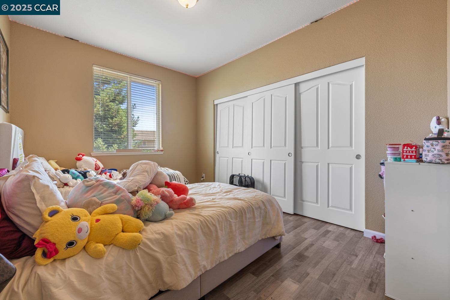 1117 Van Gogh Lane Patterson, CA 95363 - Photo 33 of 55 a bedroom with a bed and a window