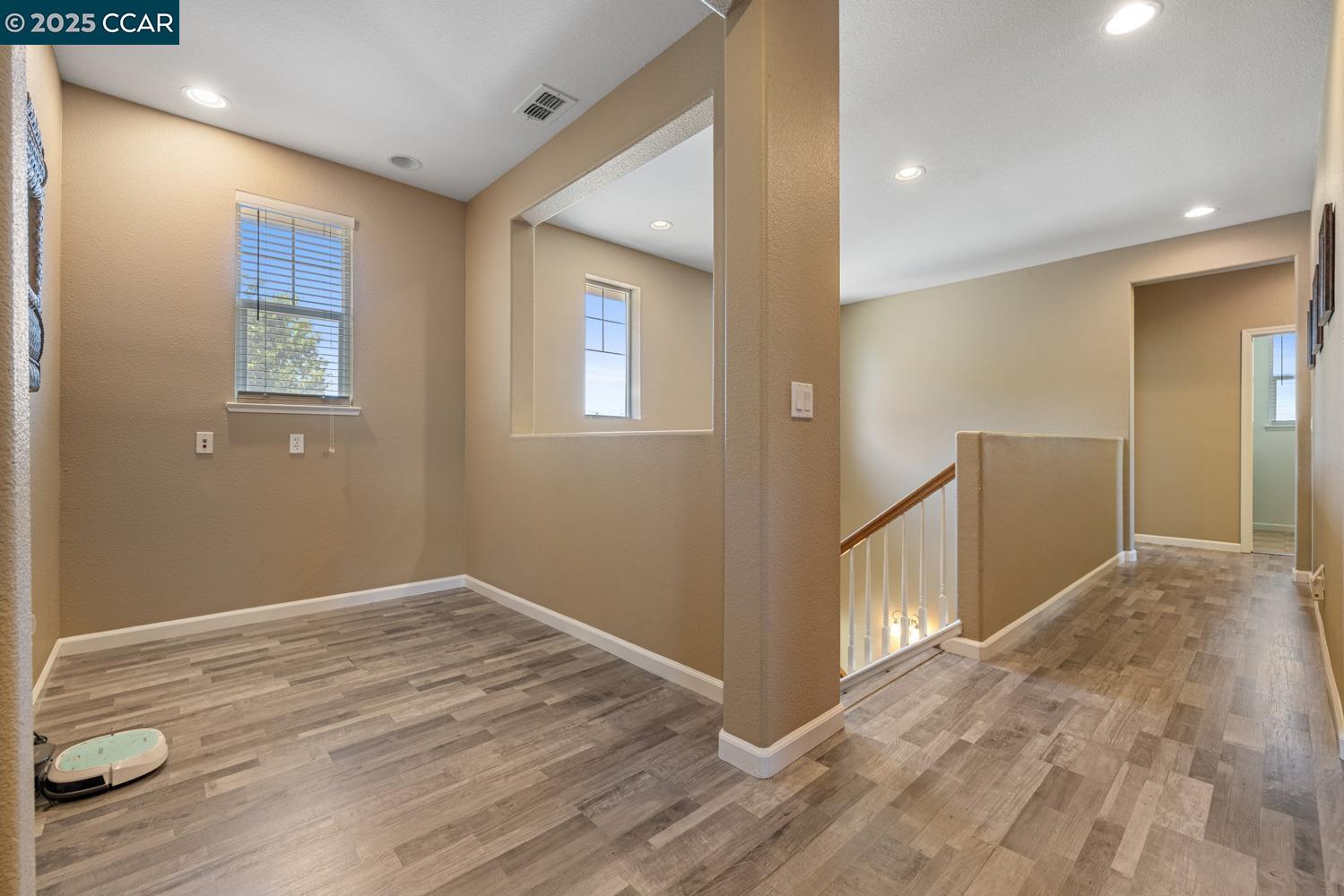 1117 Van Gogh Lane Patterson, CA 95363 - Photo 34 of 55 a view of livingroom with hardwood floor and hallway