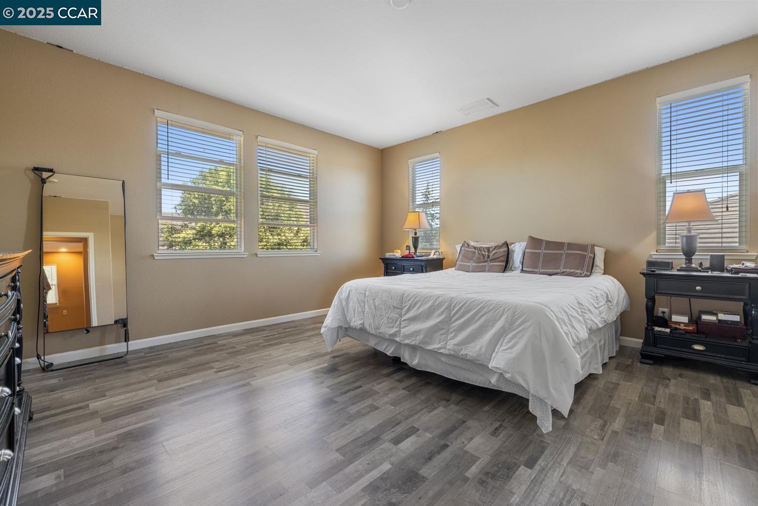 1117 Van Gogh Lane Patterson, CA 95363 - Photo 37 of 55 a bedroom with a bed and a large window